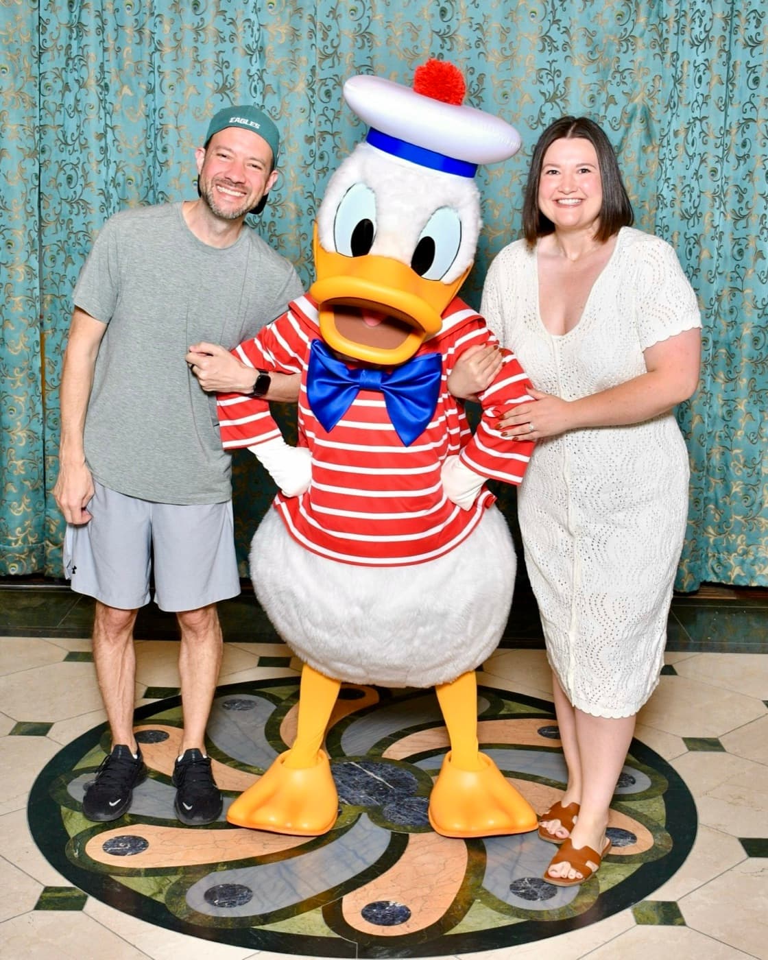 Kaitlyn and Nick posing with Donald Duck